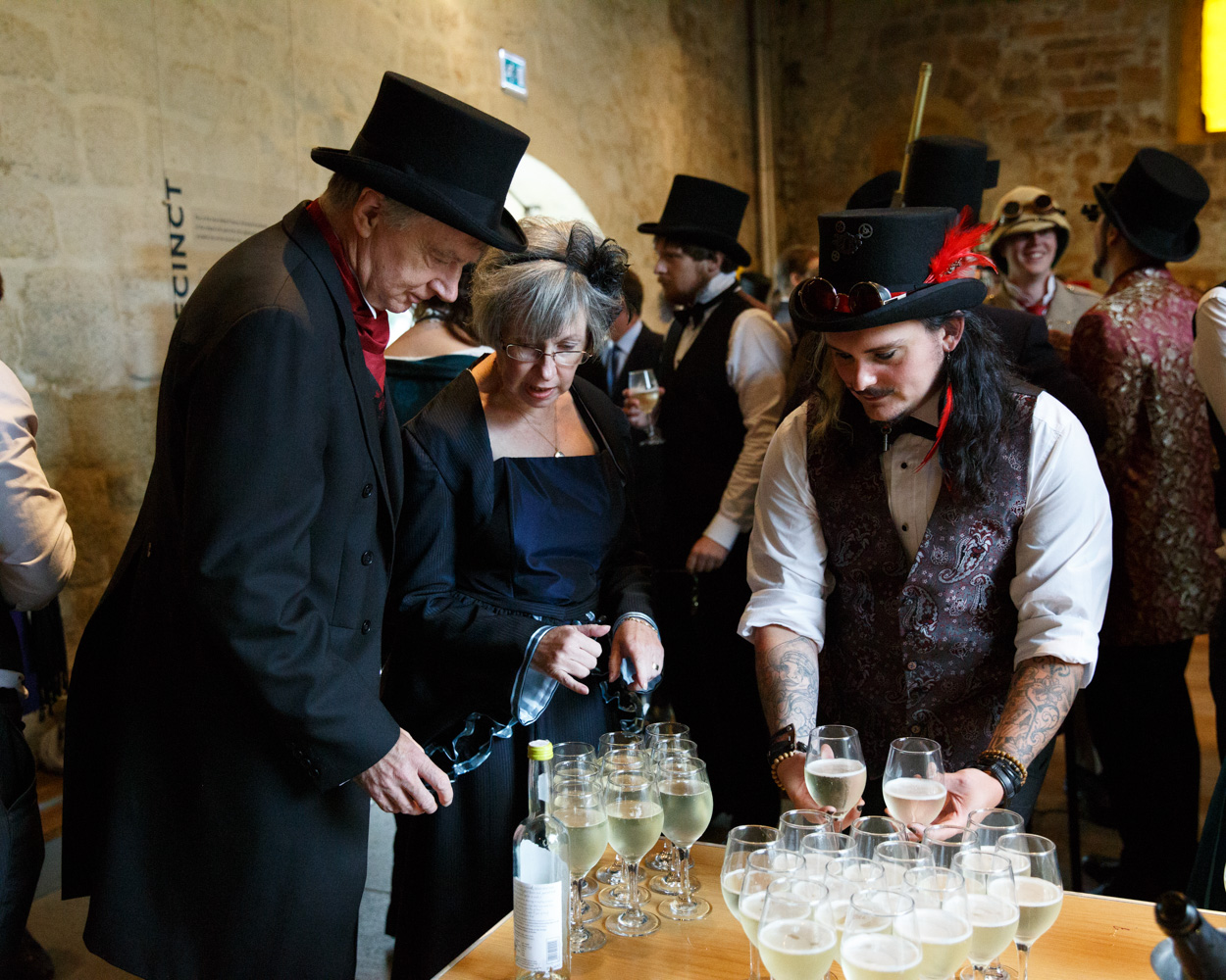Guests collect drinks and greet friends after the ceremony