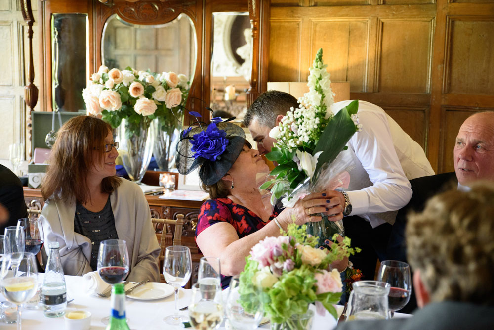 Mothers receive flower gifts during the wedding speeches.