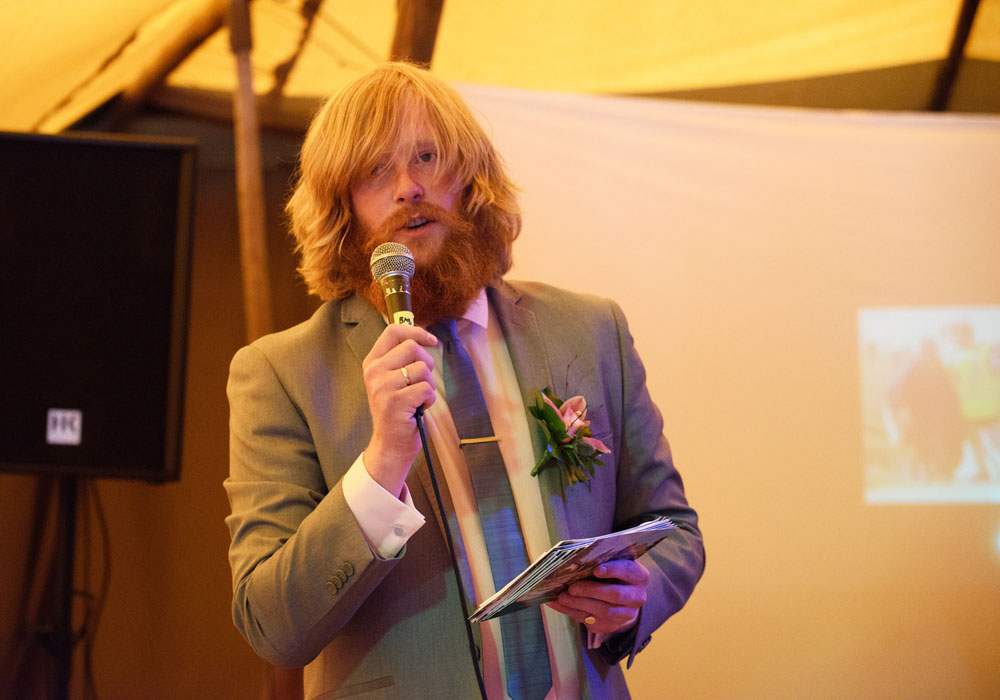 Second best man begins his wedding speech inside the Papakata tent.