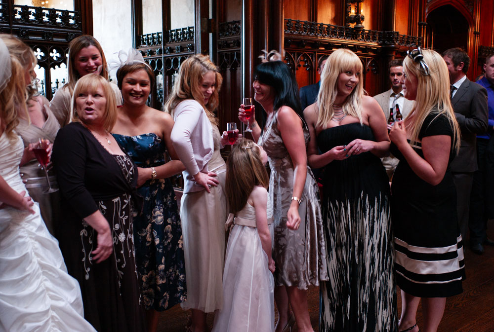 Close-up of the right side of the bridesmaids group smiling together