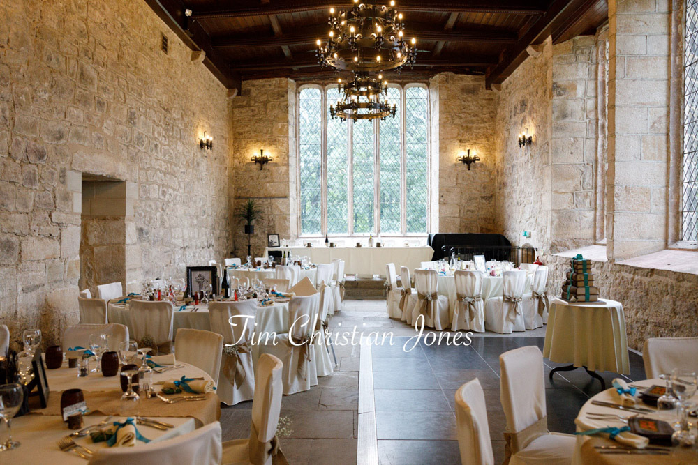 The Priest’s House wedding breakfast room set and ready, rustic charm and candlelight warmth