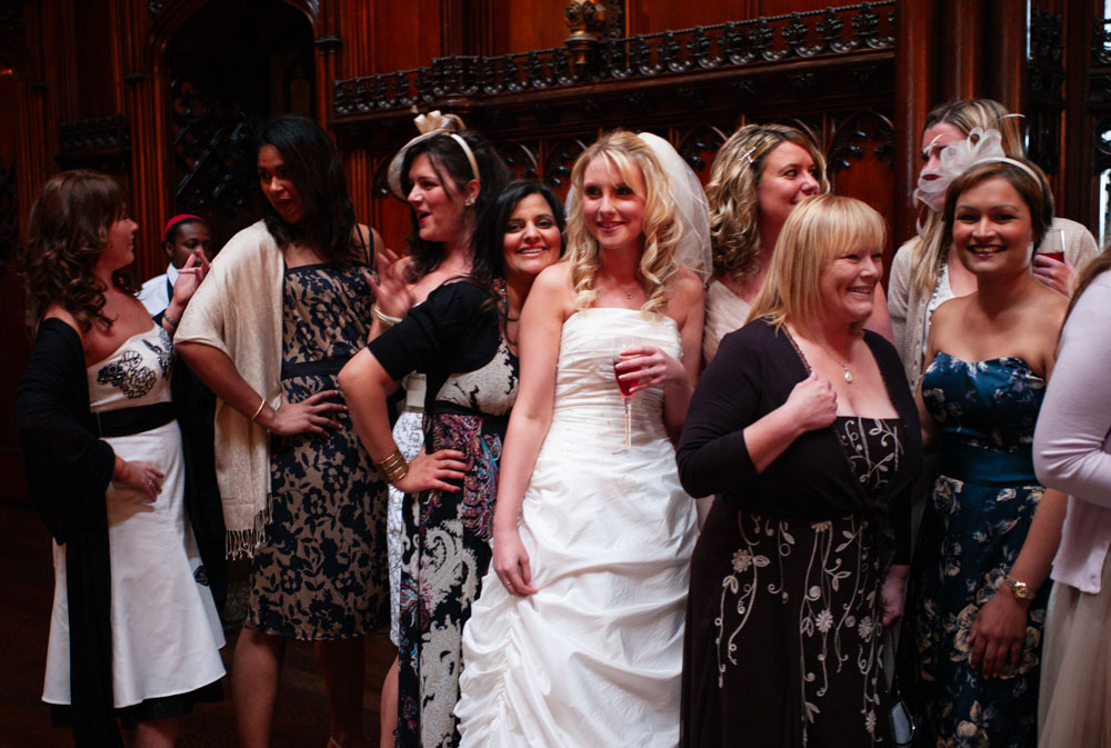 Close-up of the left side of the bridesmaids and friends smiling together