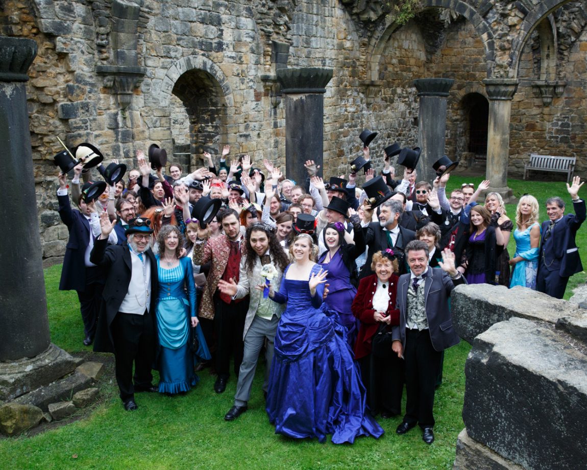 073 happy group photo in the ruins kirkstall abbey wedding linsey and chris