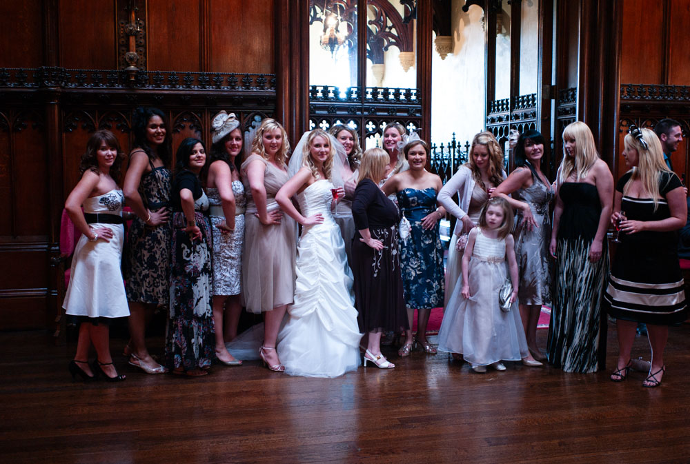 Full group of bridesmaids and friends gathered indoors at Allerton Castle