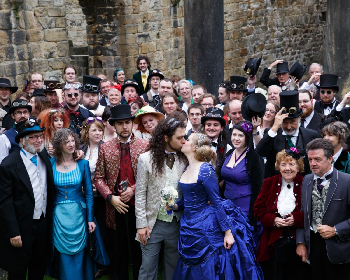 074 the couple kiss everyone reacts happily kirkstall abbey wedding linsey and chris
