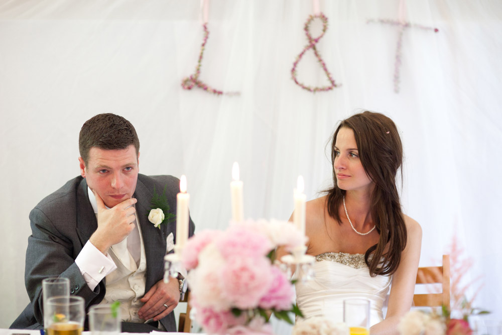 Lowri gazes at Tim with gentle empathy during the speeches