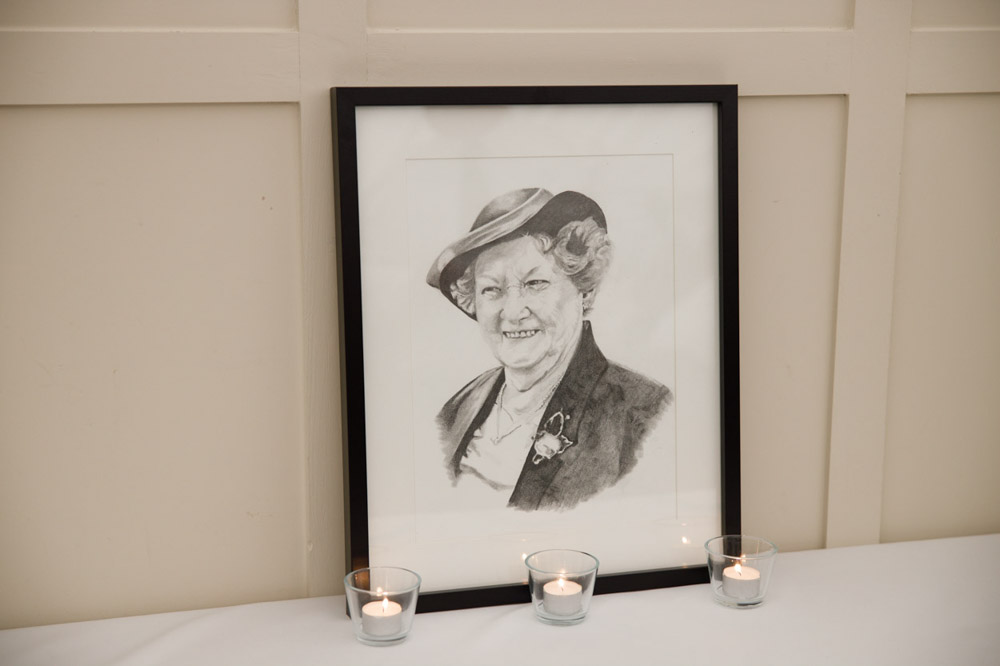 A pencil drawing of Gary’s late mum, displayed with candles.