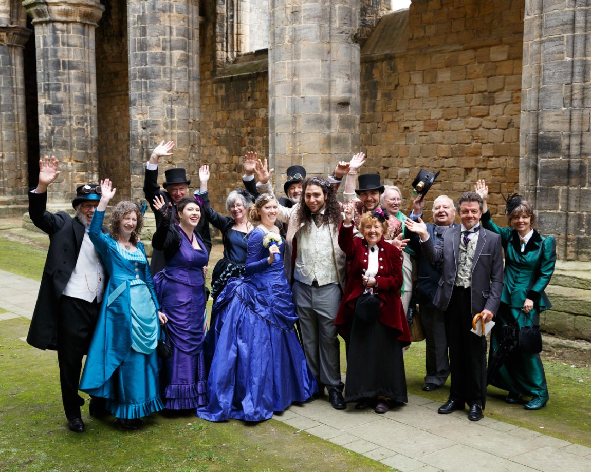 078 candid group photo everyone waving kirkstall abbey wedding linsey and chris