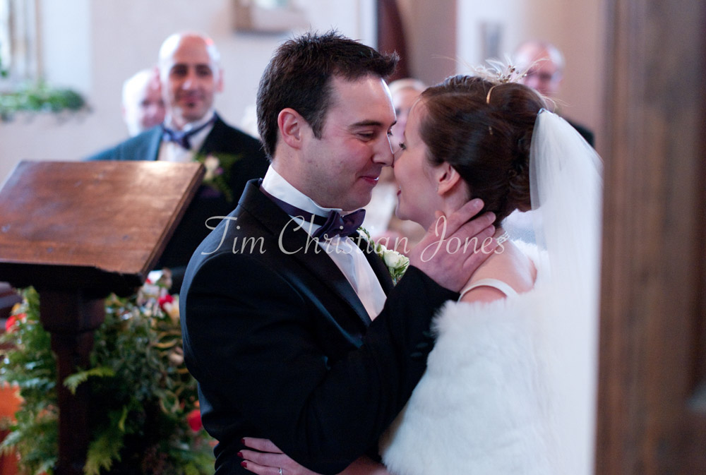 The couple share warm smiles just after their first kiss.