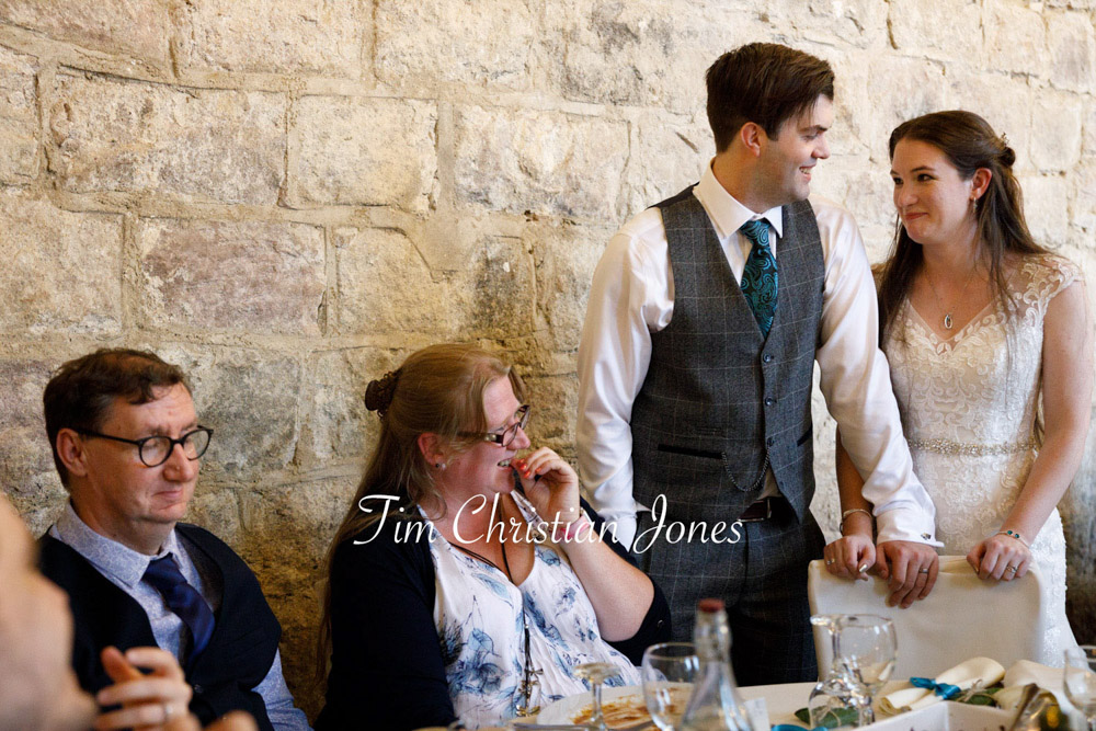 Newlyweds greet family and friends at their Yorkshire wedding.