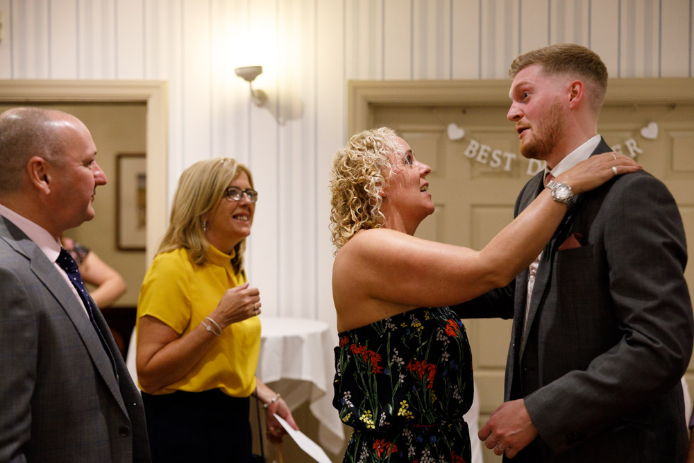 Matt greets evening guests indoors at Chevin Country Park Hotel, smiling warmly as they arrive for the reception.