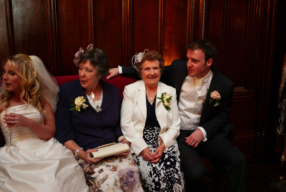 Lee with his arm around his grandma during natural group photos