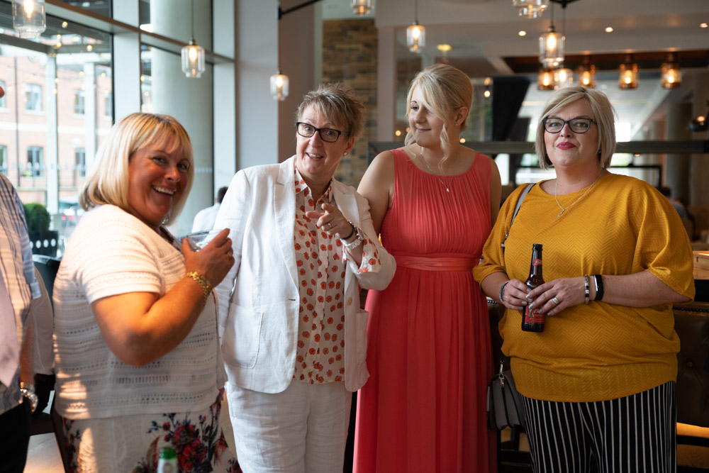 Tracey, Clare’s daughter, and two friends smiling together