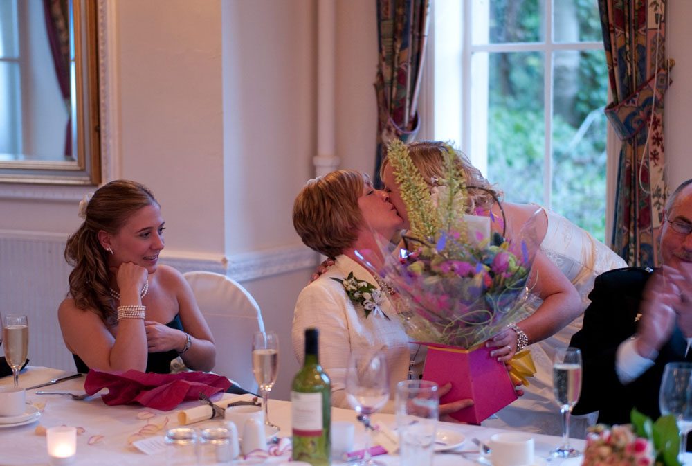 Dani kisses her mum as she passes her flowers during Scott’s speech at Hoyle Court.