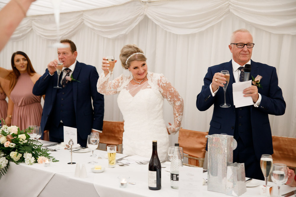 Guests raise their glasses in a toast at the end of Gary’s speech.