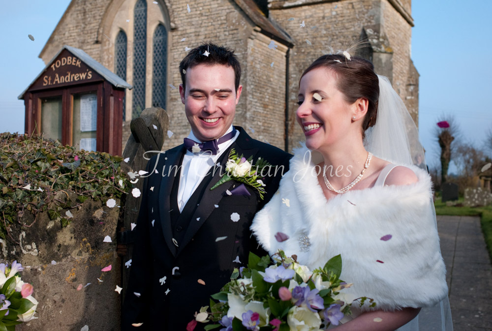 Confetti flies as the newlyweds exit the church in West Yorkshire.