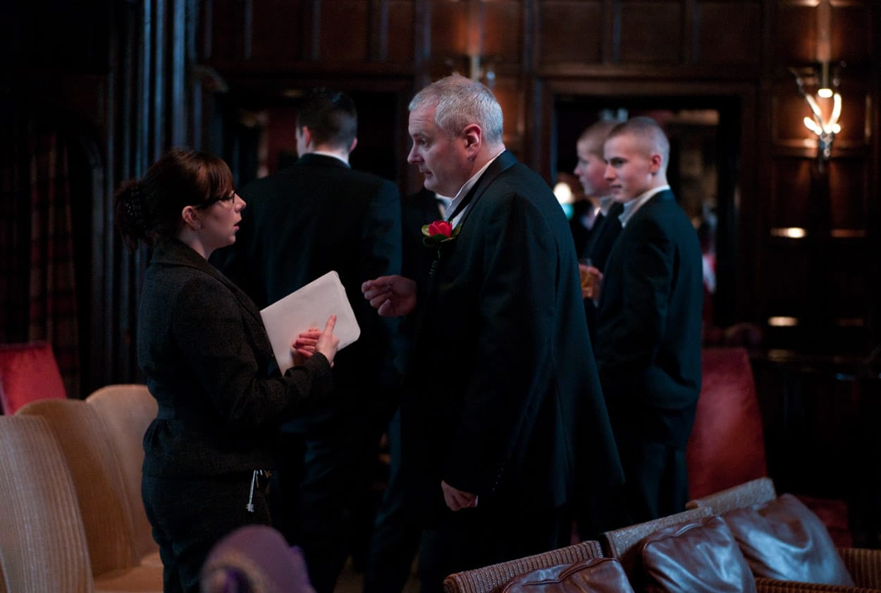 Groom chatting with the Mitton Hall coordinator before the ceremony.