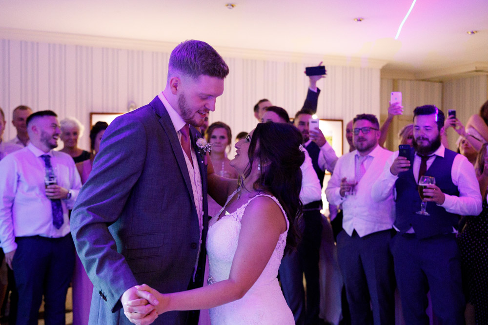 The first dance of the evening — Kyra and Matt move together as guests watch from behind at Chevin Country Park Hotel.