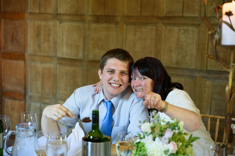 Two guests spot the camera and smile during the celebration.