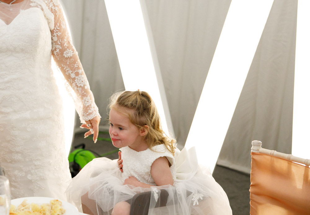 The little bridesmaid with Down's syndrome beams with joy — the star of the day.