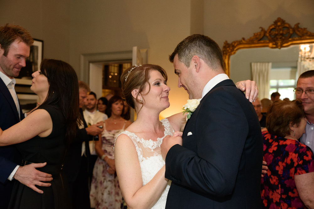Impromptu first dance captured with the couple happy and carefree.