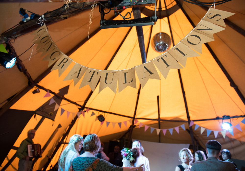 A large “Congratulations” sign hangs from the Papakata tent during the dancing.