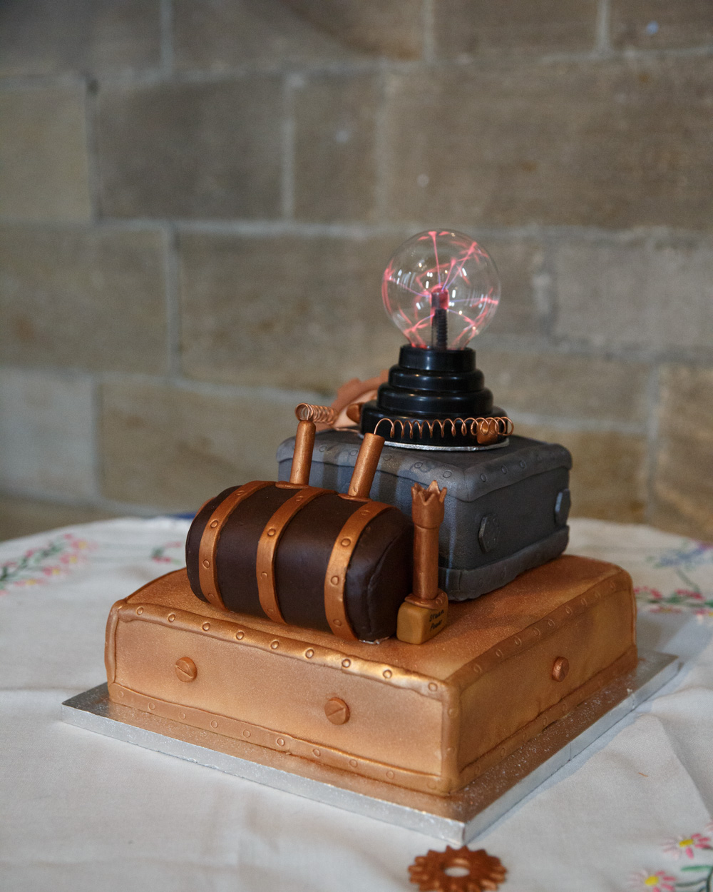A unique wedding cake styled like a power generator on display