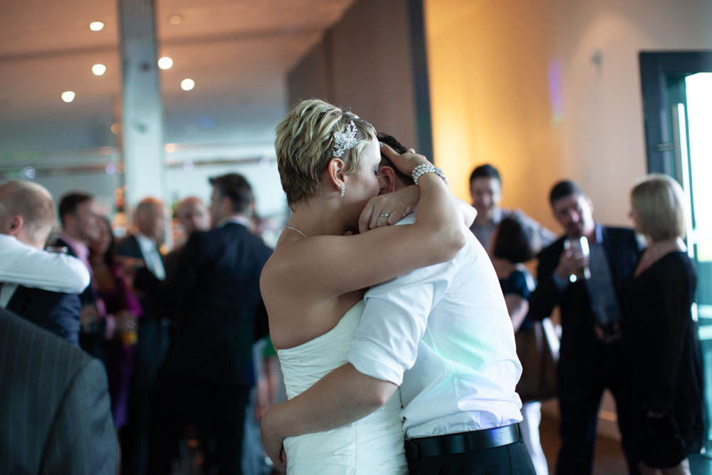 Close-up of the couple’s hands intertwined during the dance.