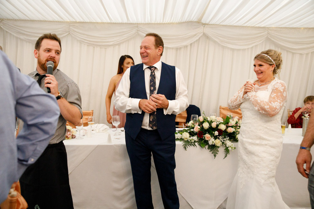 Tracy and Gary join the dance floor smiling with the crowd.