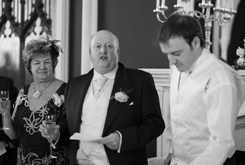 Guests applaud with joy during the father of the bride's wedding toast