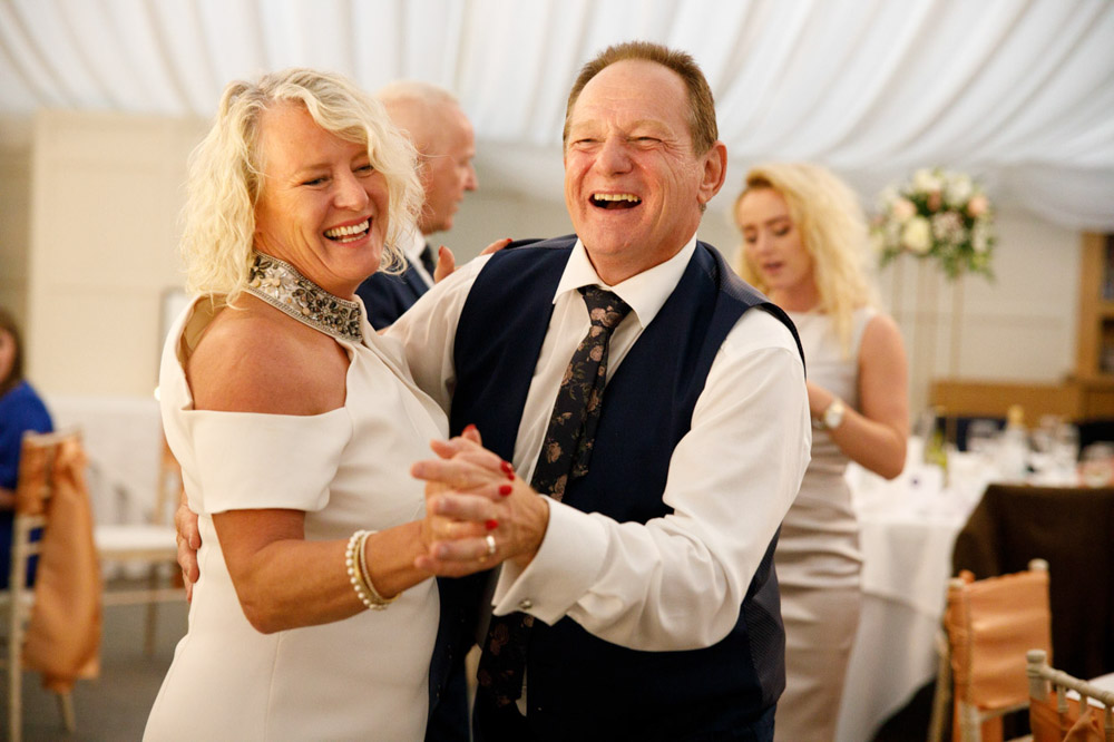 Gary dances with a friend during the lively reception.