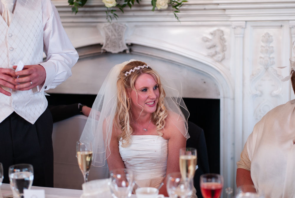 Vicky looks toward the best men, smiling just before they speak