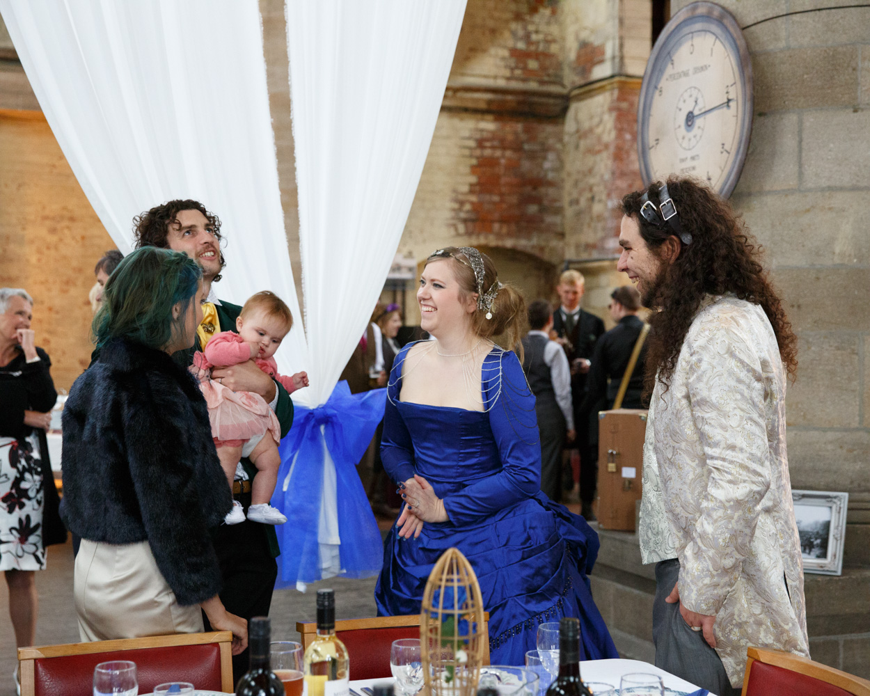 The couple greet friends and family inside the grand space at Left Bank Leeds