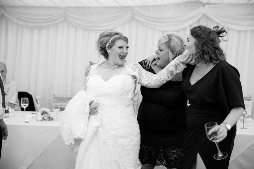 Tracy singing with friends, beaming with happiness.