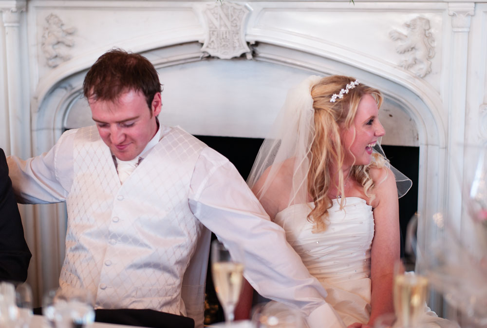 Vicky laughs while Lee looks a little embarrassed as the best men speak