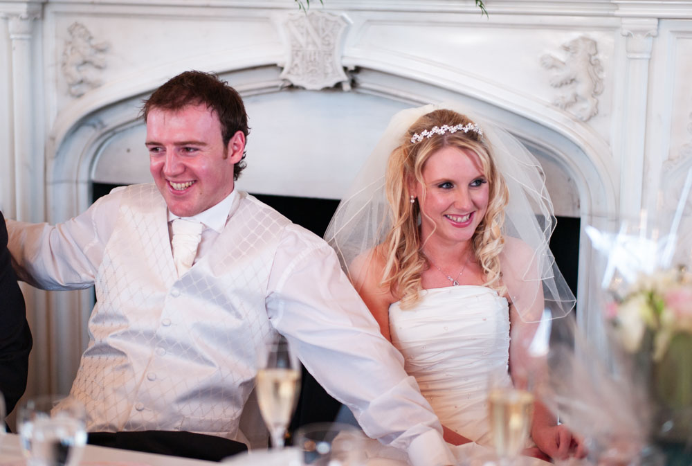 Lee joins in the laughter as Vicky laughs beside him and guests look on