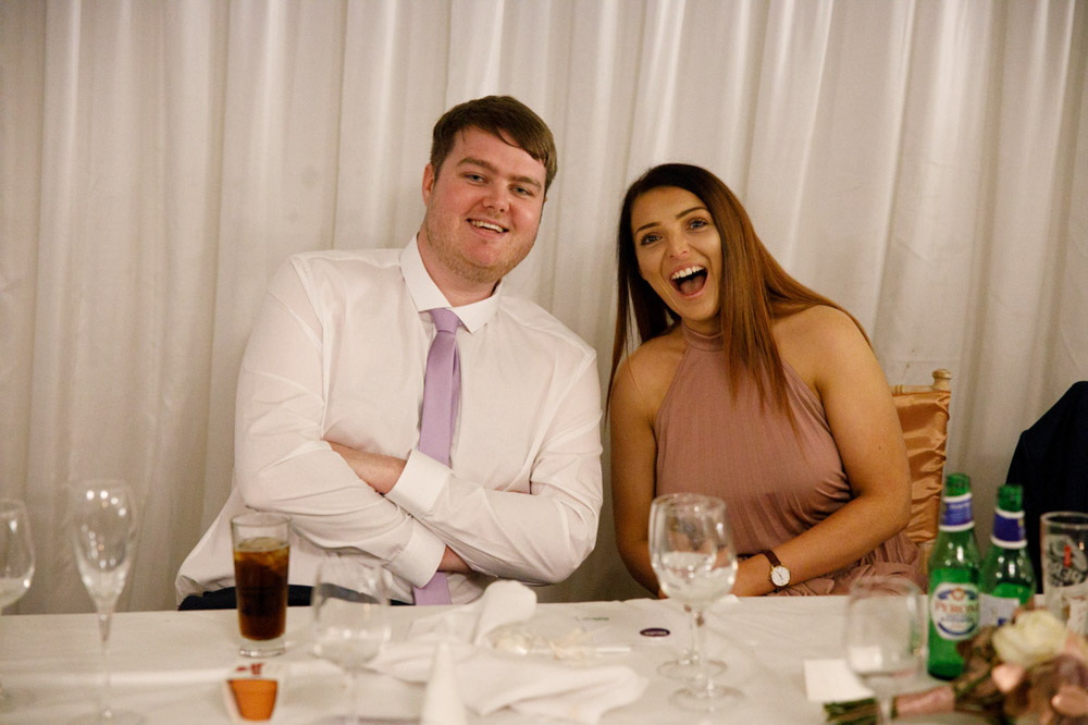 Bridesmaid and a friend smiling