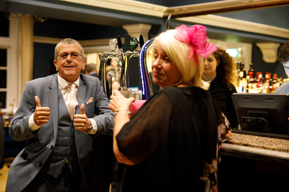 Guest gives a thumbs-up at the bar as the I leave.