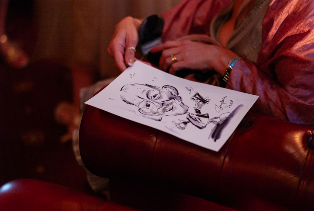 A fun sketch from the wedding caricaturist shows a humorous portrait