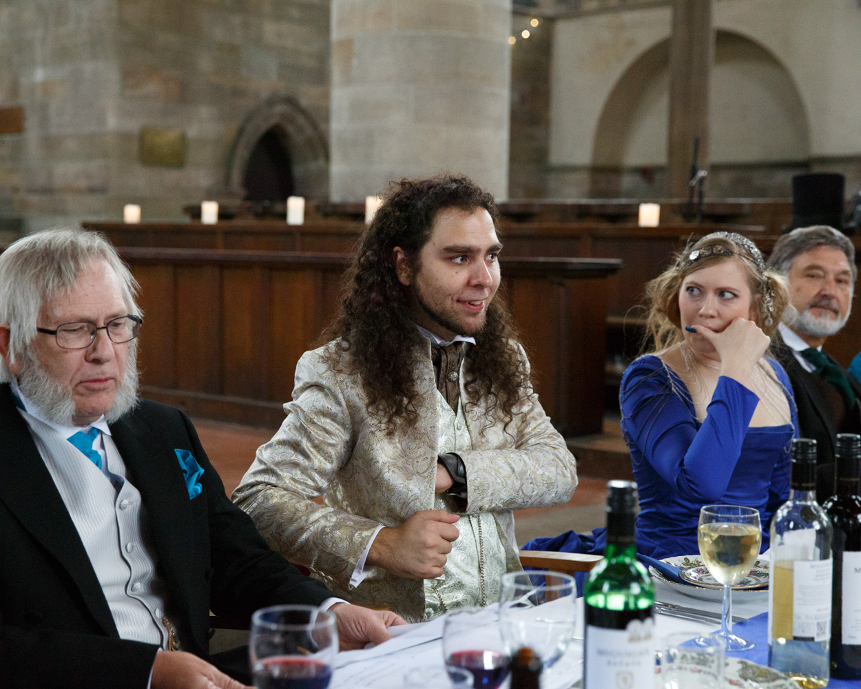 The groom reaches into his pocket to begin his speech