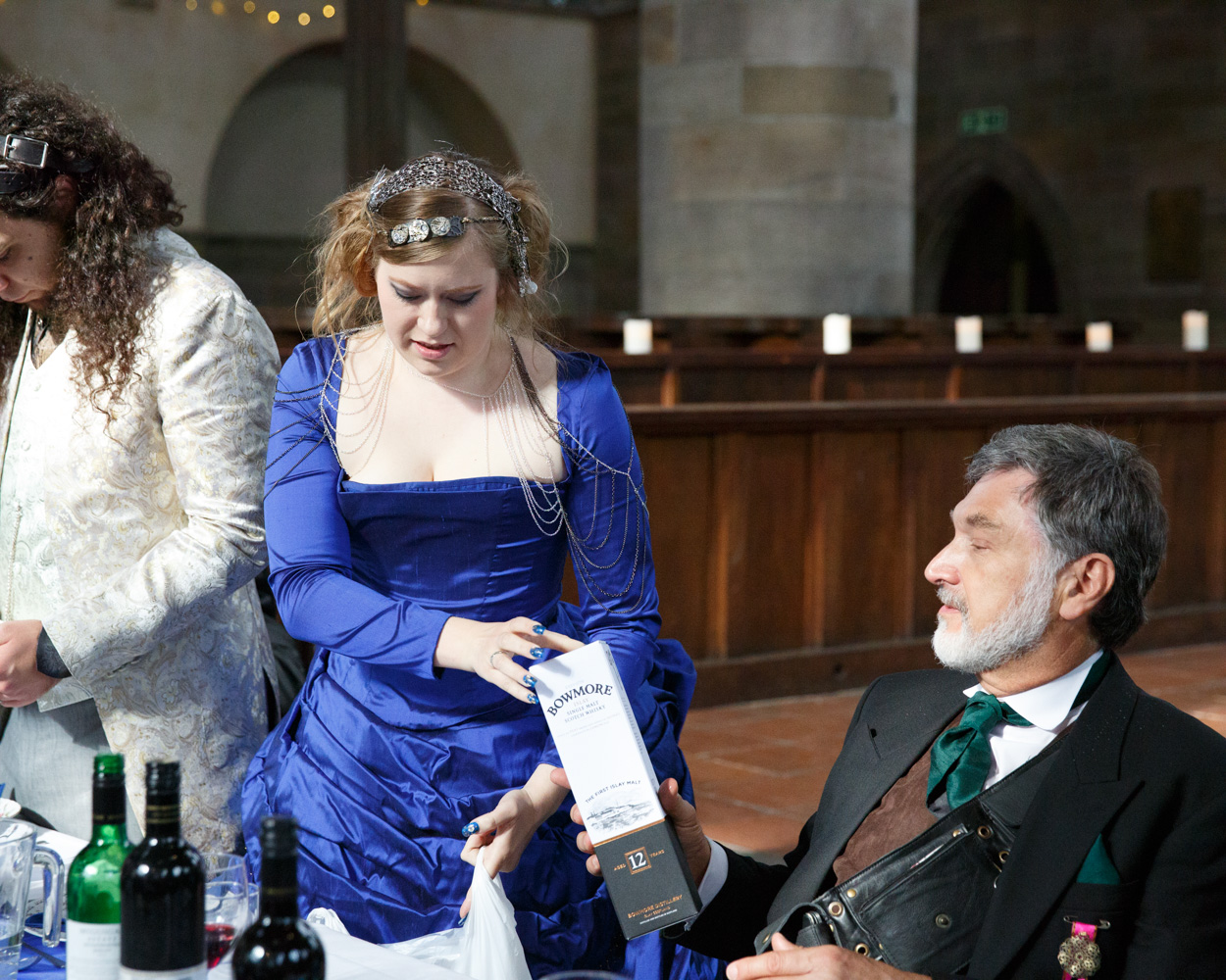 The groom speaks as Linsey hands out small gifts
