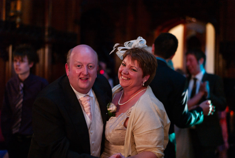 Vicky’s parents dancing nearby as the floor fills with happy guests