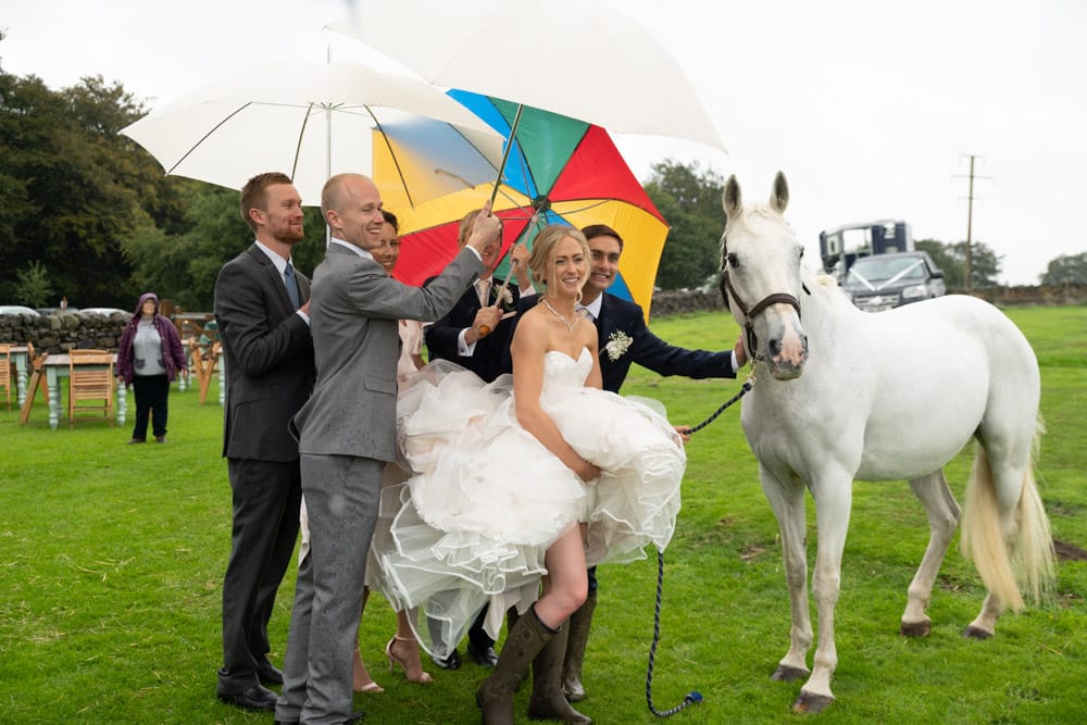 143 chilli barn otley couple umbrellas horse helen adam