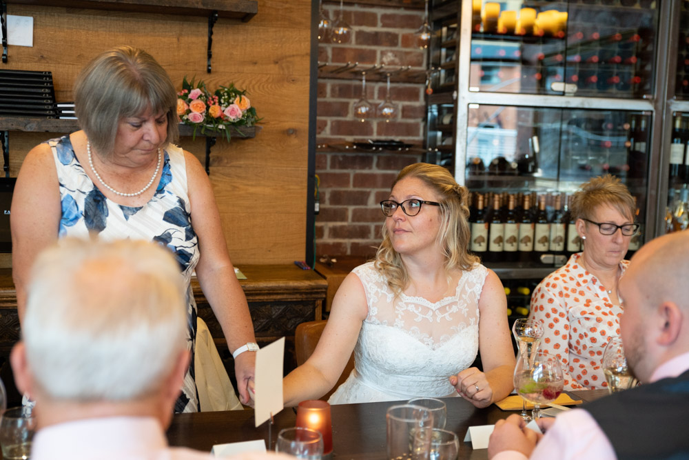 Clare’s mum holding her daughter’s hand during her speech