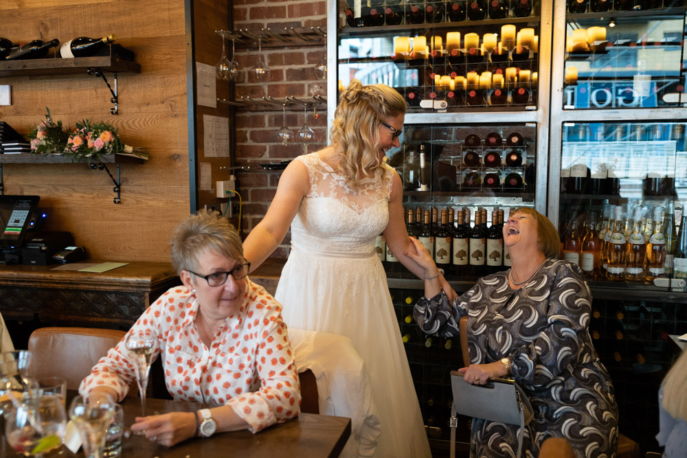 The couple enjoying a fun moment with family