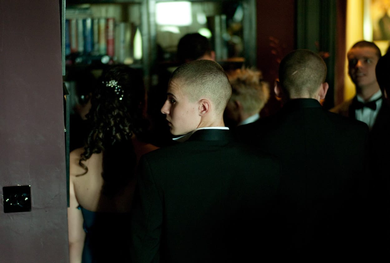 Low-light profile portrait of the groom’s son.
