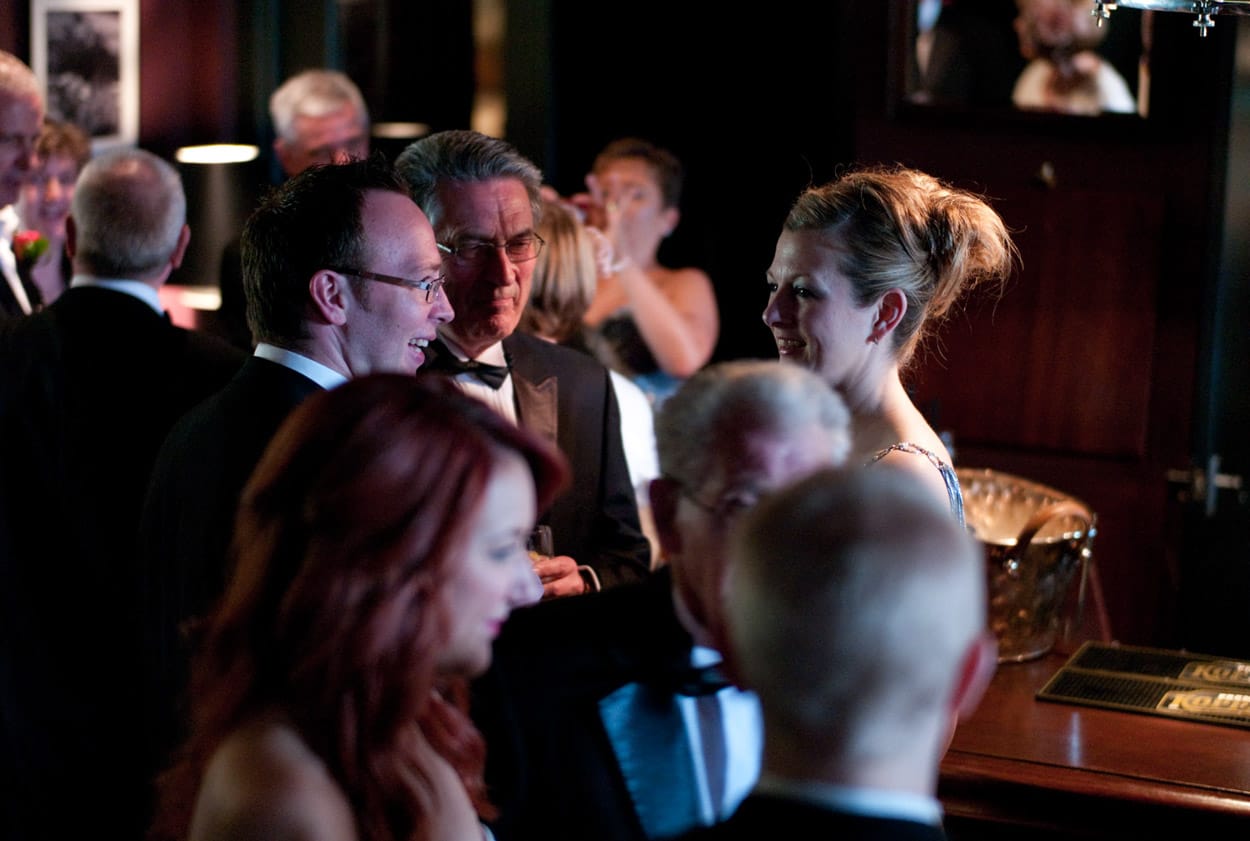 Happy guests chatting at the Mitton Hall bar before the ceremony.