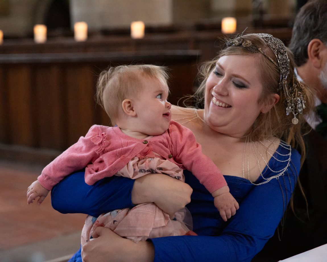 169 linsey holding little baby they both smile left bank leeds wedding reception linsey and chris