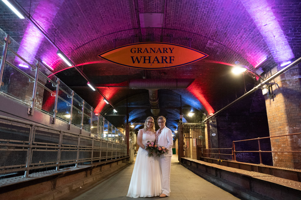 The couple in the Granary Wharf tunnel beneath the colour-changing lights