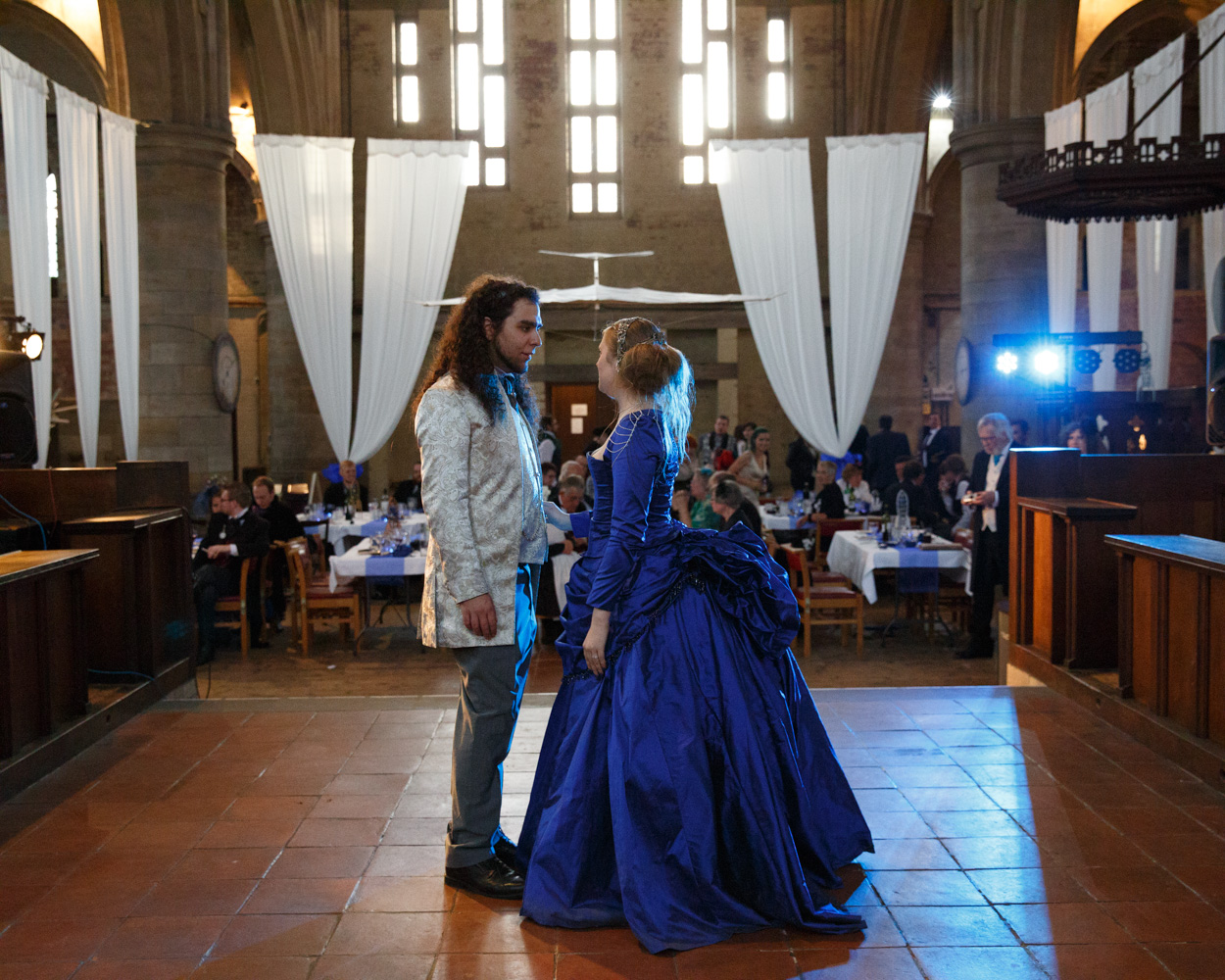 The couple stand together moments before their first dance